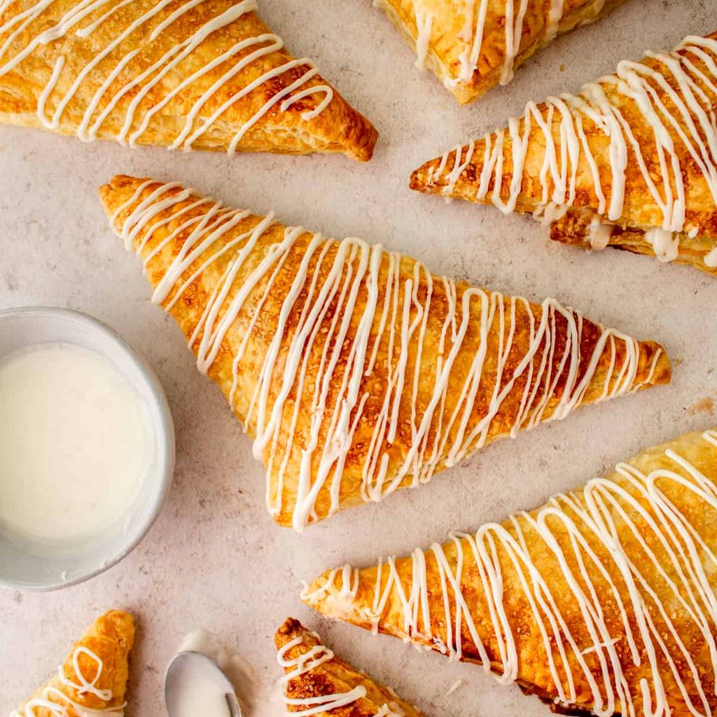 Puff pastry apple turnovers dusted with sugar