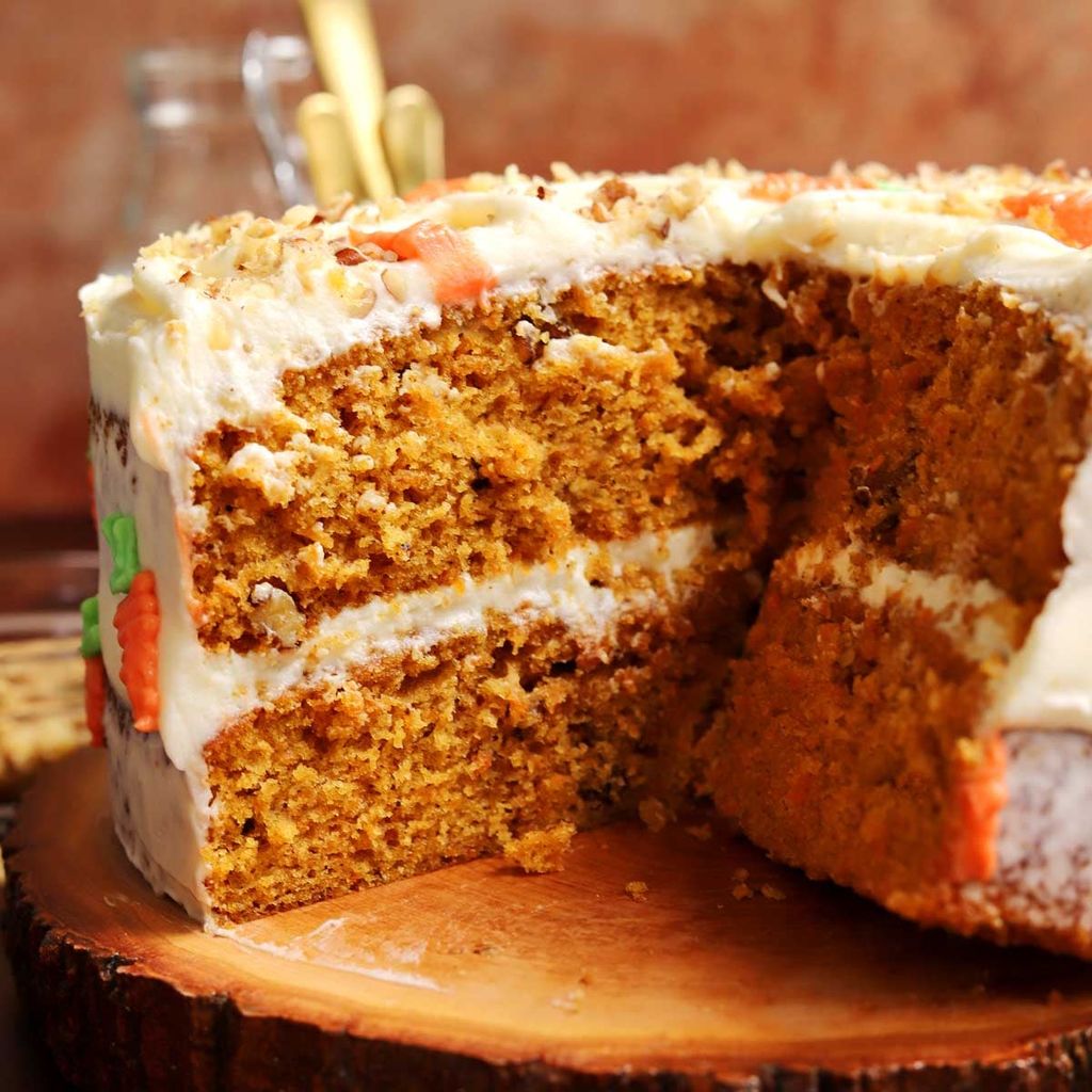 Carrot cake with cream cheese frosting and walnuts